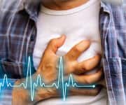 Man clutching his heart