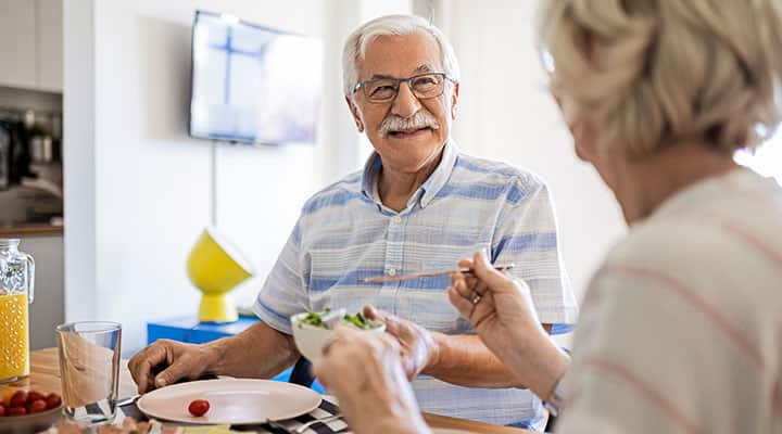 Senior couple having breakfast