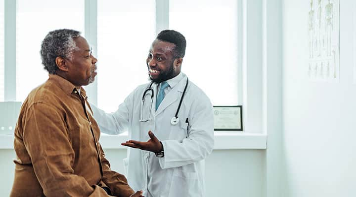 Male patient talking to his doctor