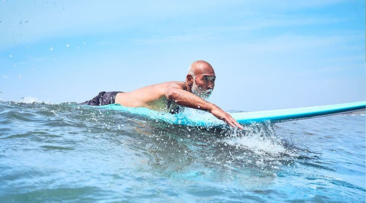 Man surfing for longevity