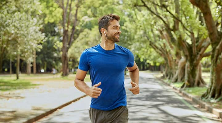 Man running in the park to improve his heart health