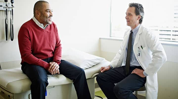 Prostate cancer patient talks with his doctor