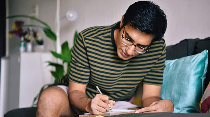 Man writing in his journal