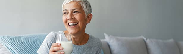 Healthy mature woman laughing with strong immune system