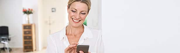 Smiling woman viewing lab results on her phone