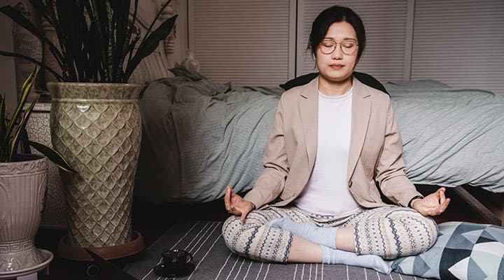 Woman creating a cozy workout ambiance