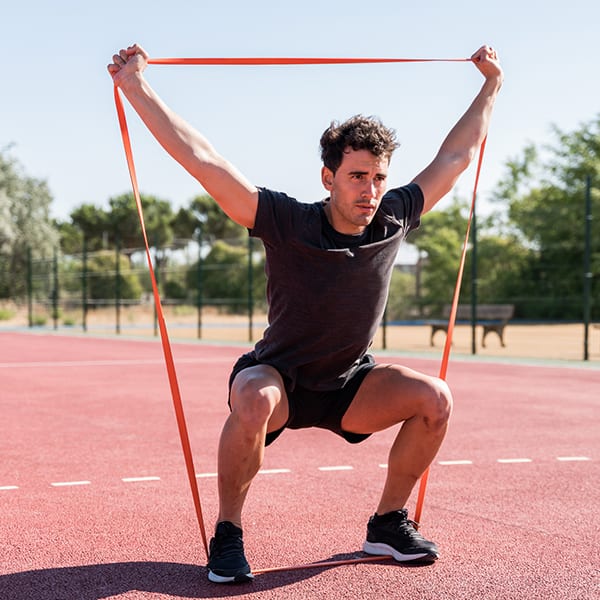 A lateral leg lift is one of many exercises you can do with resistance bands