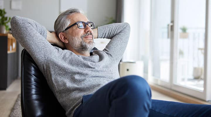 Man relaxing on a chair to support immune health