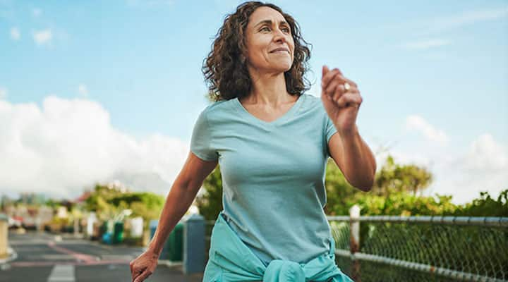 Woman power walking to help with menopause