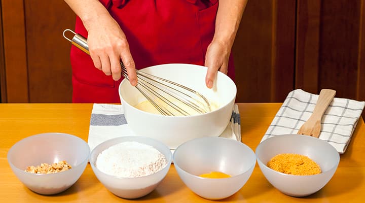 Whisking ingredients to make banana bread