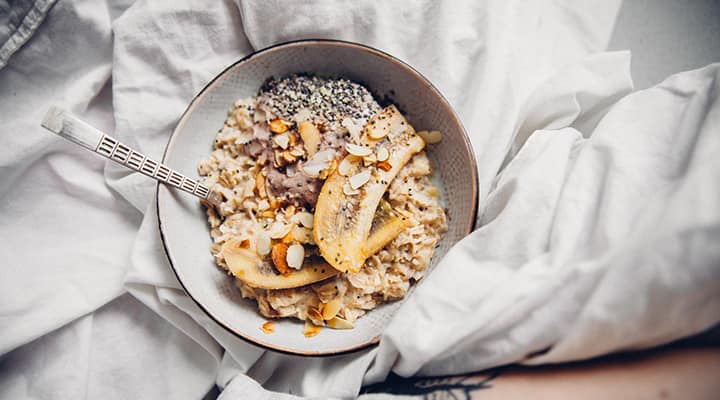 Bowl with mixed oats, bananas, and nuts