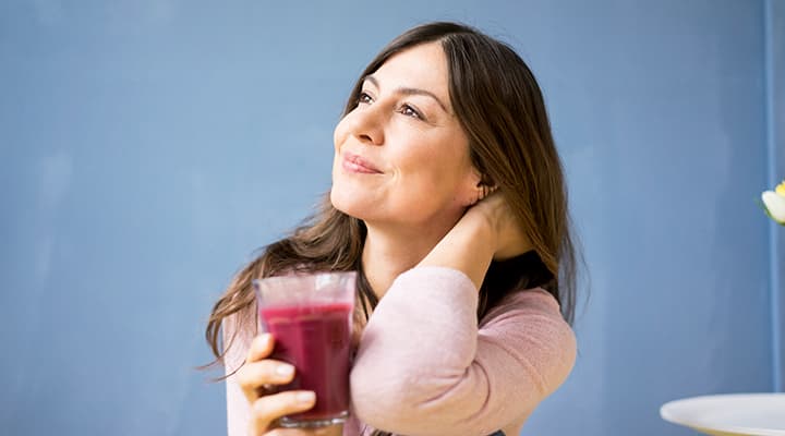 Woman drinking a healthy detox juice