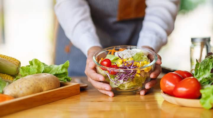 Healthy meal prep of sala in a clear bowl