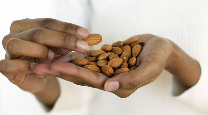 Handful of almonds which are a popular nut