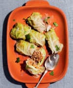 Stuffed Cabbage with Buckwheat and Pumpkin on a orange serving plate 