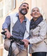 Couple looking at city after biking