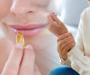 Woman taking fish oil pill