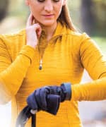 Woman in yellow checking heart rate 