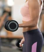 Woman with dumbbell preserving muscle mass