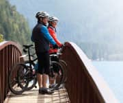 Couple on bridge after bike ride