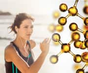 Woman running on beach supplementing with fish oil