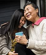 Daughter laughing with mother with higher selenium blood levels