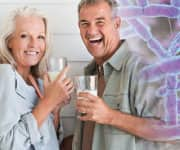 Mature couple drinking milk with probiotic blend boost