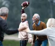 Woman throwing football supplementing with two forms of vitamin K