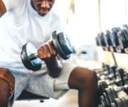 Man curling wight to maintain muscle mass from low testosterone