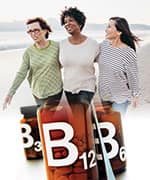 Three women walking on the beach using B vitamins for reduction of homocysteine levels