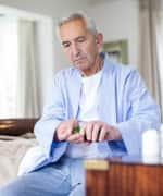 Senior man using ashwagandha extract to enhance sleep quantity and quality