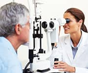 Optometrist examining patient’s eyes for dry eye syndrome and natural tears production