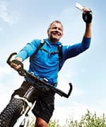 Man on bicycle using omega-3 fatty acids for whole-body health