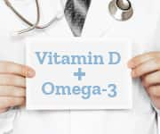 Physician holding notecard that says 'vitamin d + omega-3'