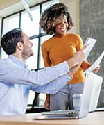 Woman and man discussing work progress through improved cognitive performance