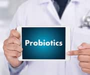 Doctor holding sign that says probiotics that yeast fermentate and CRL1505 fall under