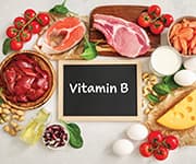 Foods surrounding chalkboard with vitamin B written out