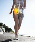 Woman jogging supporting hip bone through collagen peptides