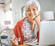 Senior woman smiling researching erothioneine levels for cognitive impairment