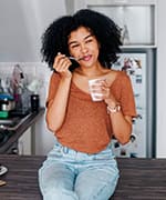 Woman enjoying probiotic blend of yogurt with L. plantarum