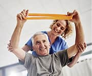 Man using resistance band for physical therapy after stroke