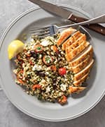 Pan-seared chicken breasts with artichoke, tomato, and bulgur pilaf