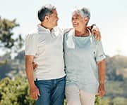 Senior couple walking in the sun to correct vitamin D deficiency