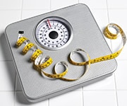 Bathroom scale to monitor long-term reduction of body weight