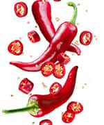 Whole and sliced red chili peppers that contain capsaicin