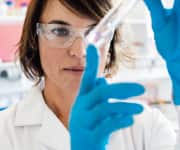 Lab researcher examining a tolerable formulated capsaicin formula