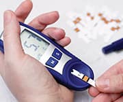 Man taking blood sugar levels for metabolic health