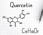 Quercetin's chemical structure and formula is written out in black ink