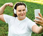 Woman feeling good and taking selfie with phone