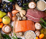 Spread of fish, fruits, and whole grains that show longevity benefits